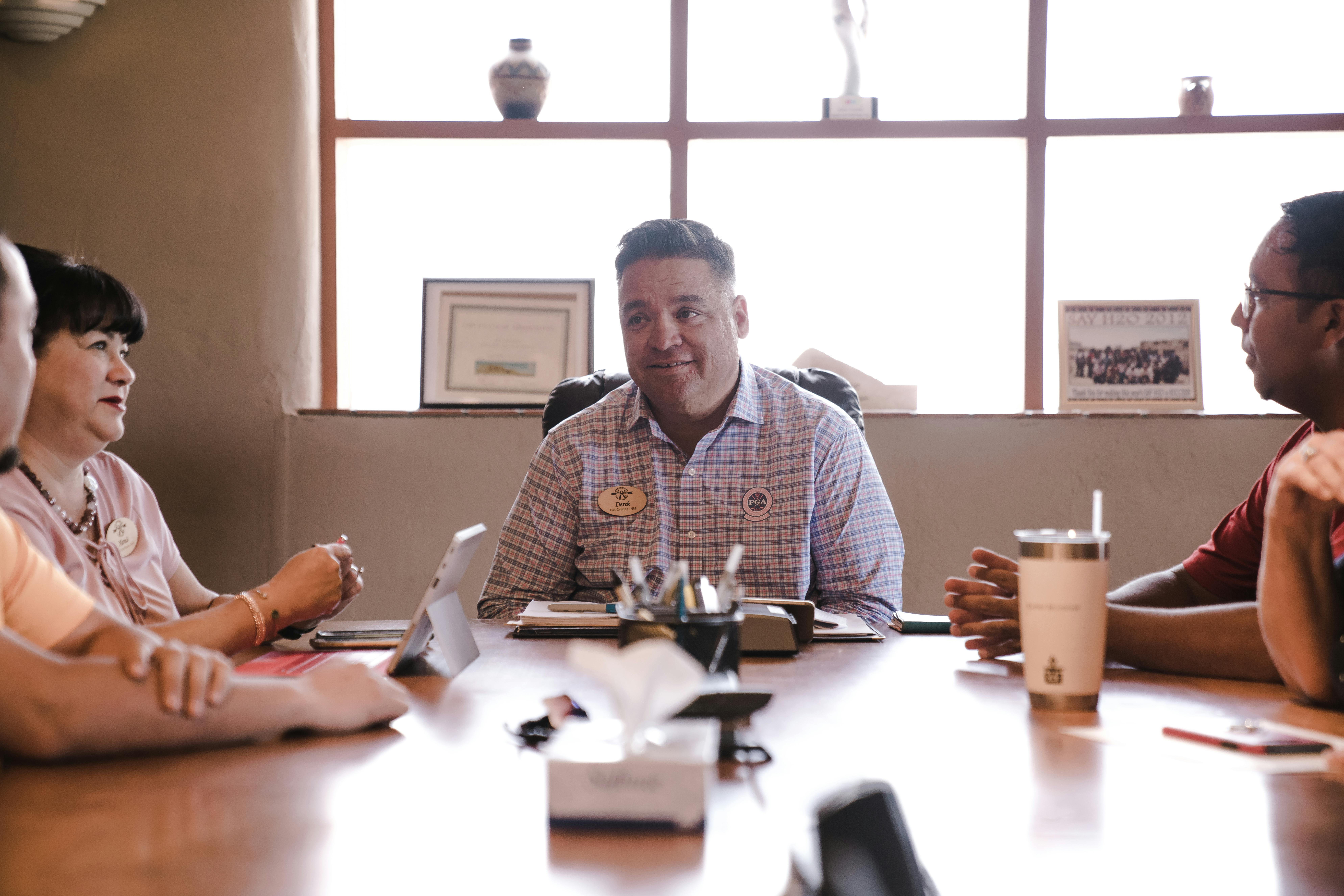 A group of people having a conversation.